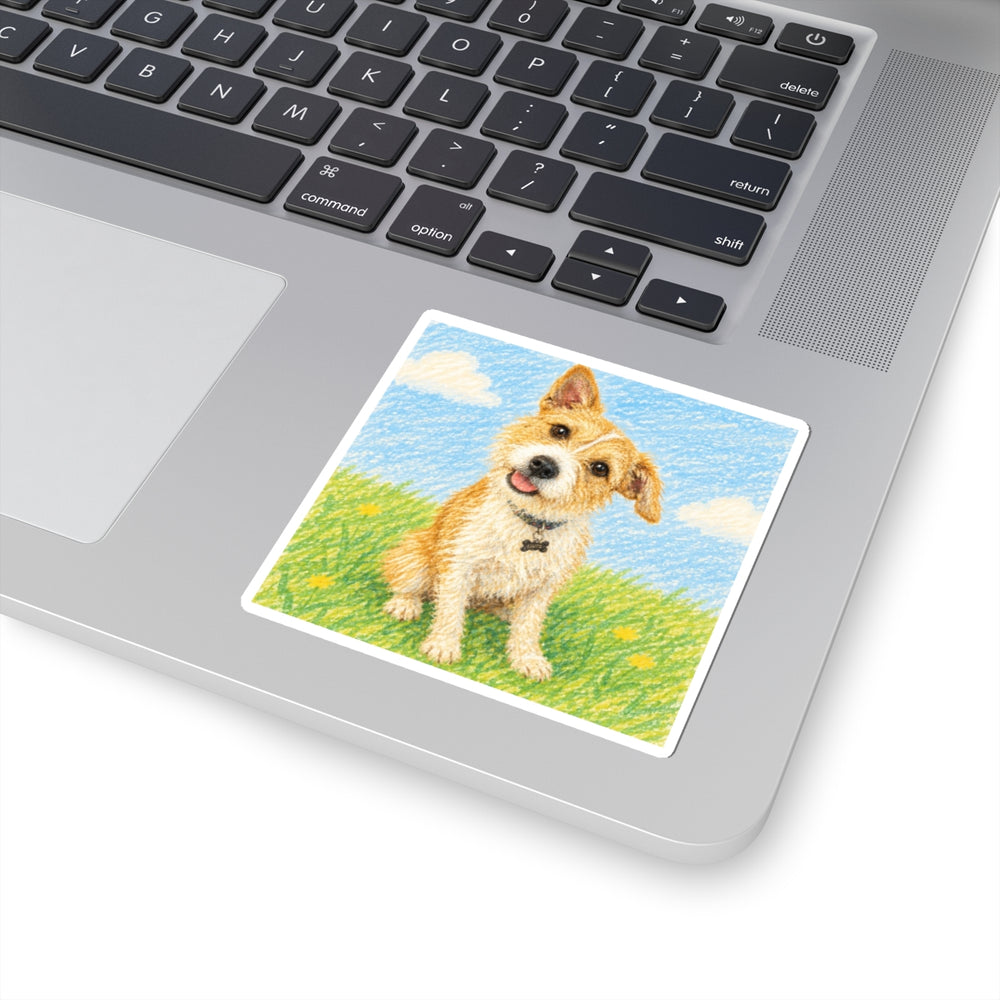 A child's dog drawing printed as a vinyl sticker, stuck on a laptop